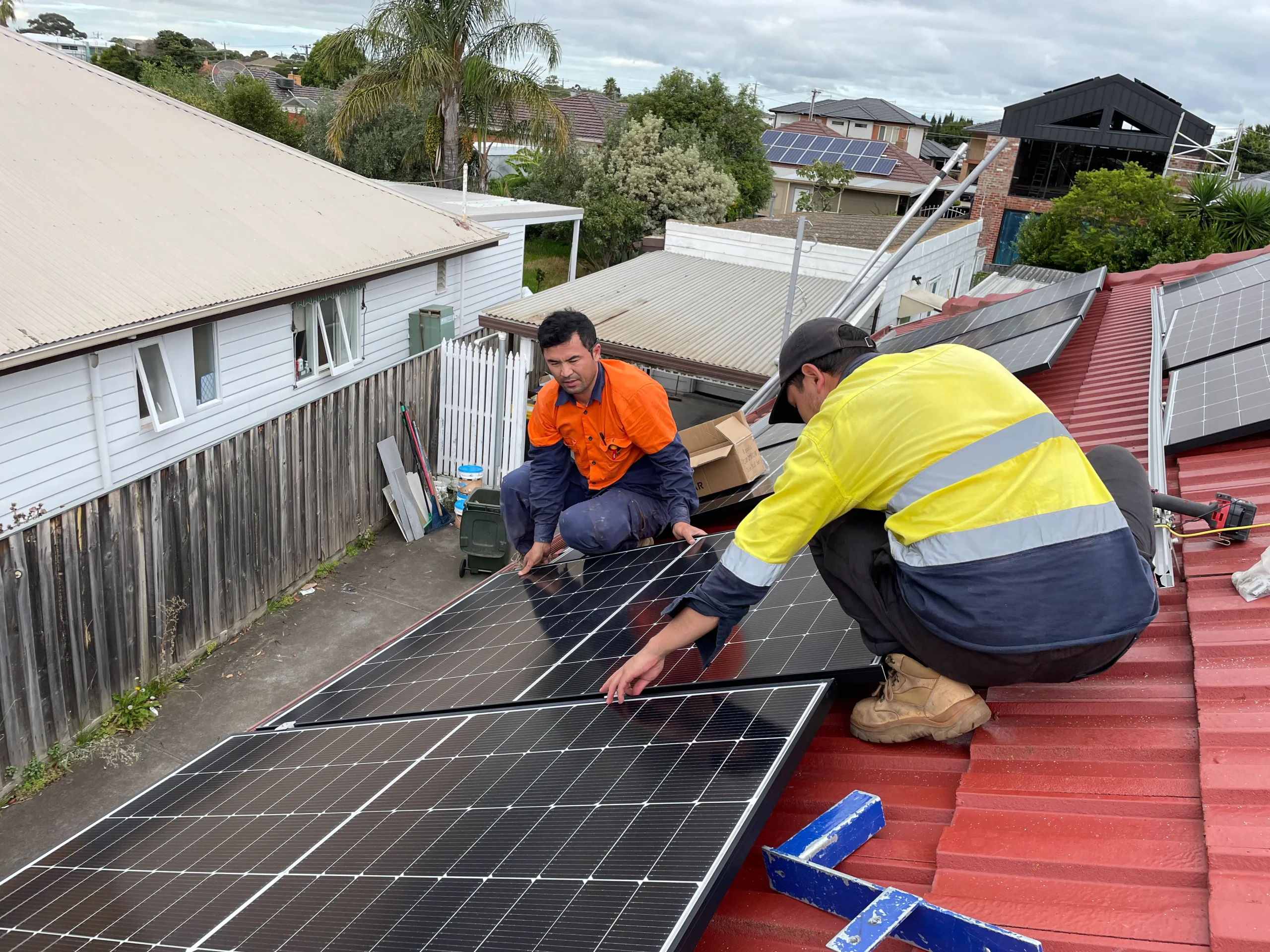 two men installing Residential Solar Panels in Geelong